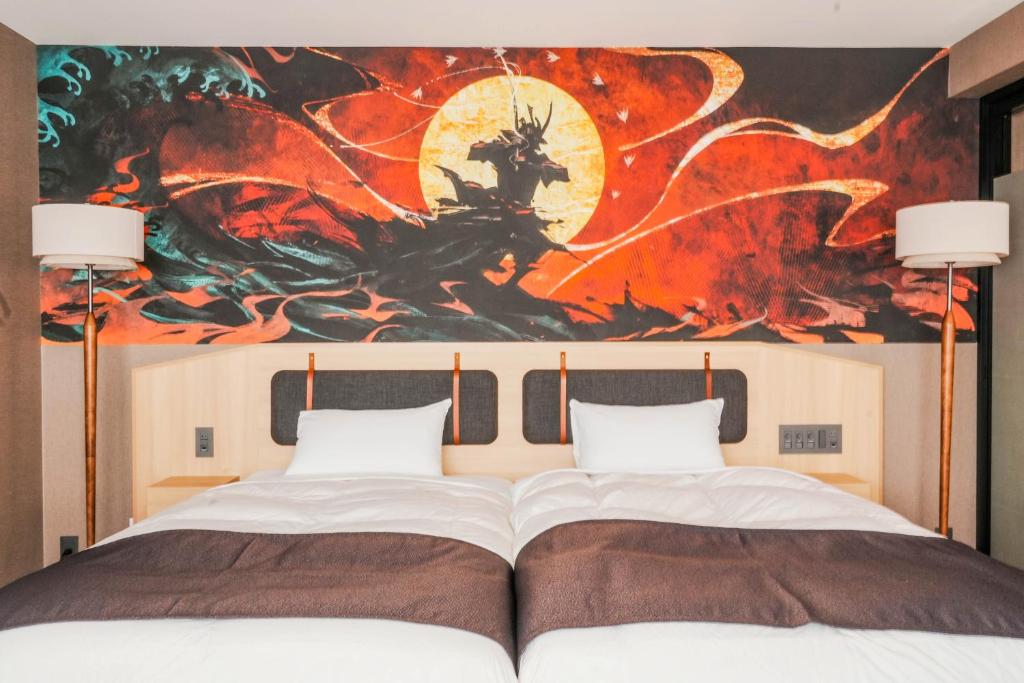 Postel nebo postele na pokoji v ubytování Kyoto Pleasant Hotel