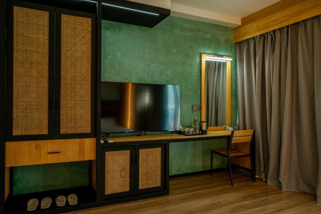 TV a/nebo společenská místnost v ubytování Athiri Residence