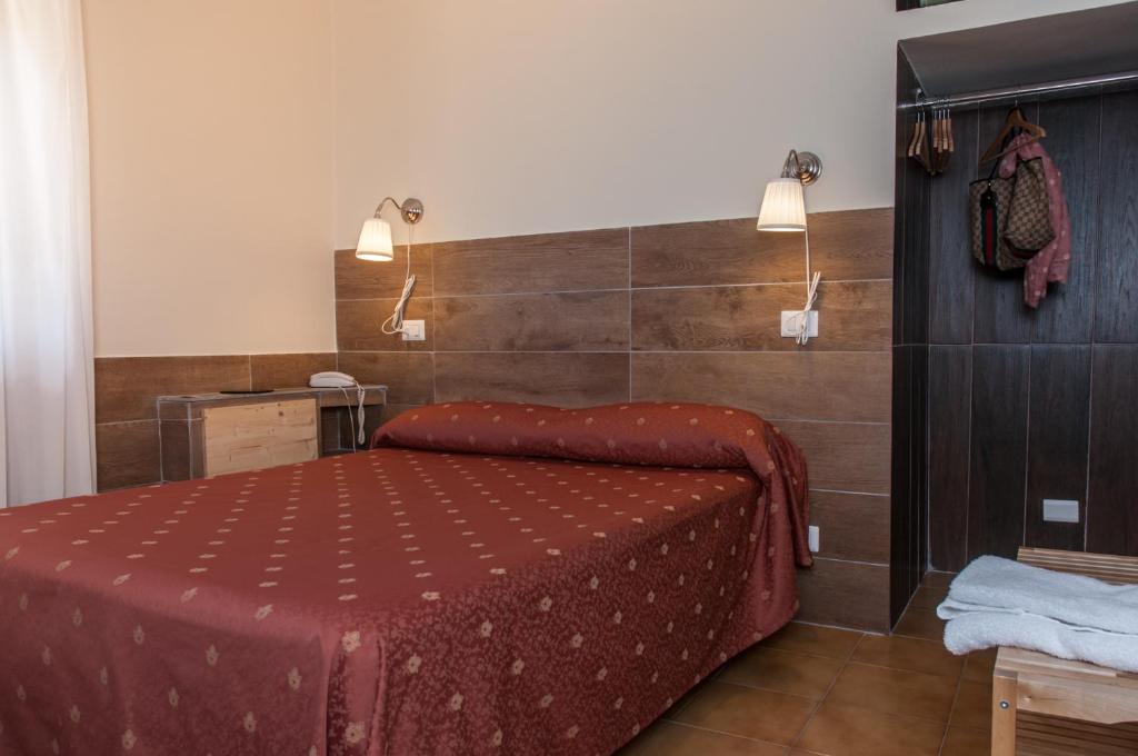 Postel nebo postele na pokoji v ubytování Hotel Il Roscio