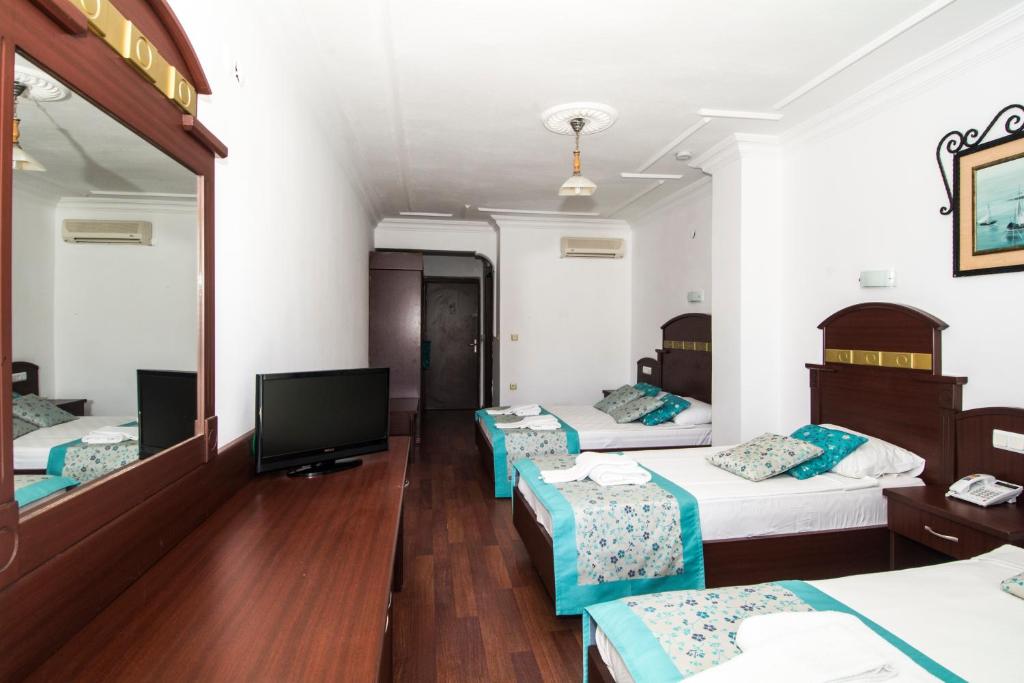 Postel nebo postele na pokoji v ubytování Sunberk Hotel