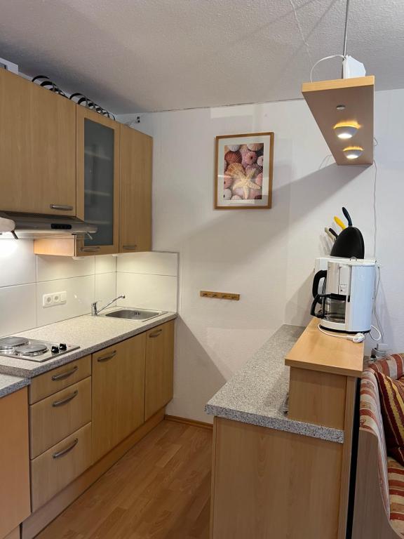 A kitchen or kitchenette at Wohnung 35m2 mit Traum Panorama und 30m2 Terrasse