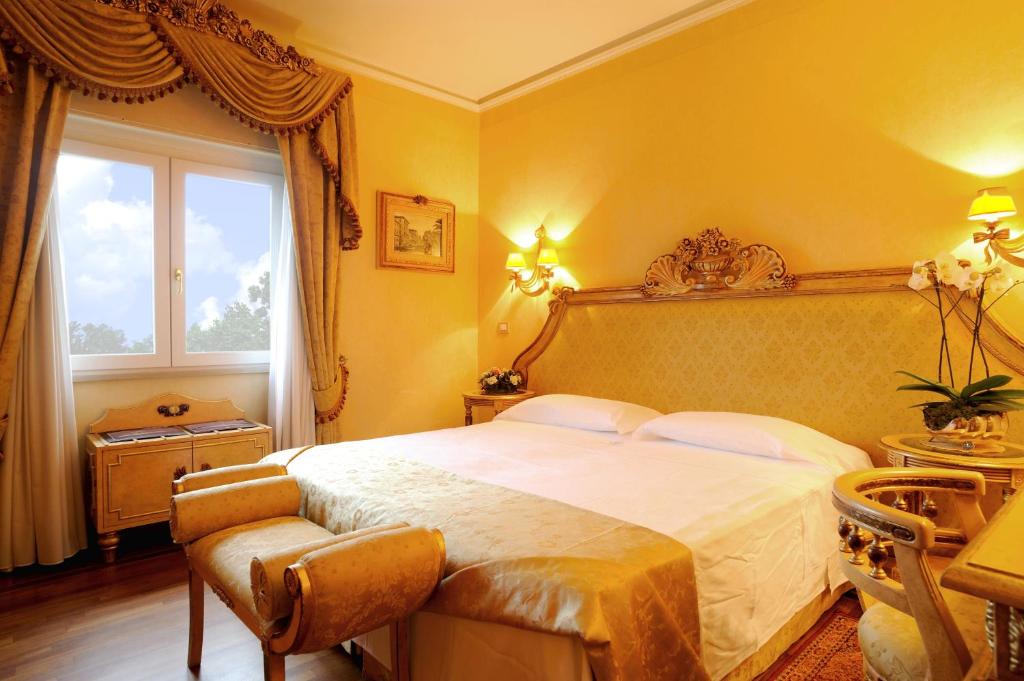 Postel nebo postele na pokoji v ubytování Park Hotel Villa Ariston