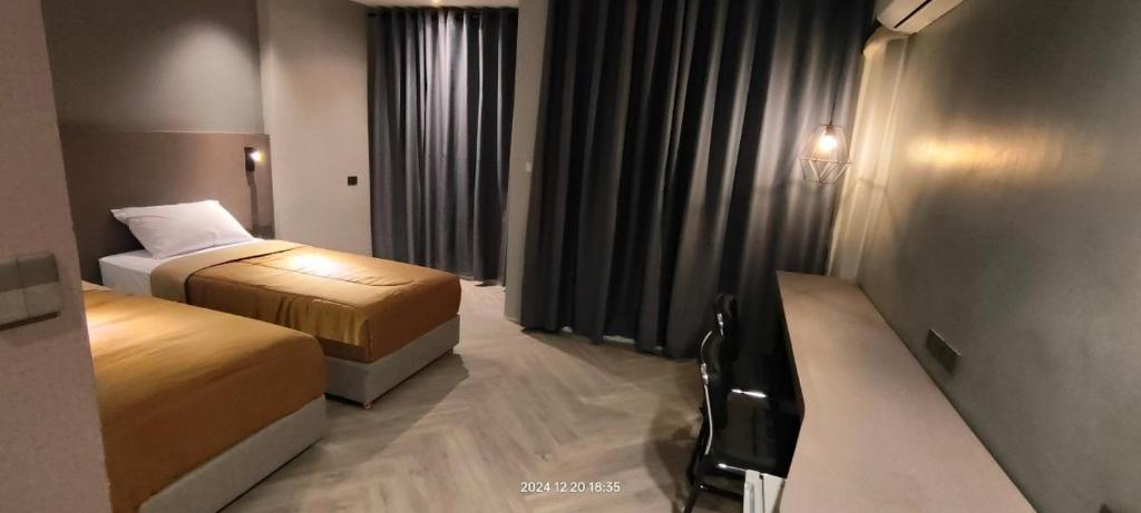 Postel nebo postele na pokoji v ubytování Doze Patong