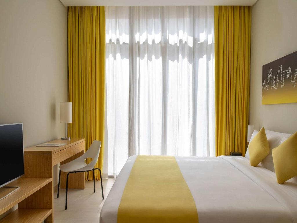 Postel nebo postele na pokoji v ubytování Adagio Doha