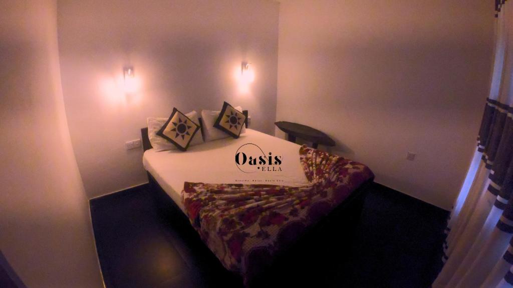 Postel nebo postele na pokoji v ubytování Oasis Ella