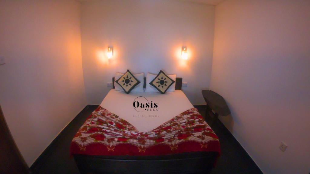 Postel nebo postele na pokoji v ubytování Oasis Ella