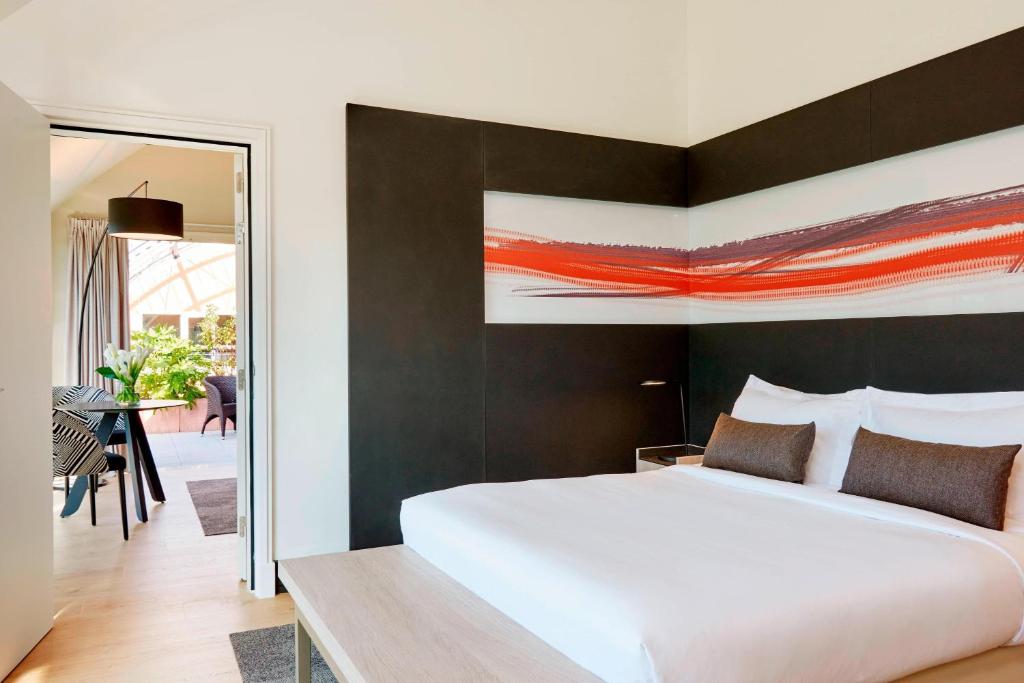Postel nebo postele na pokoji v ubytování Lyon Marriott Hotel Cité Internationale