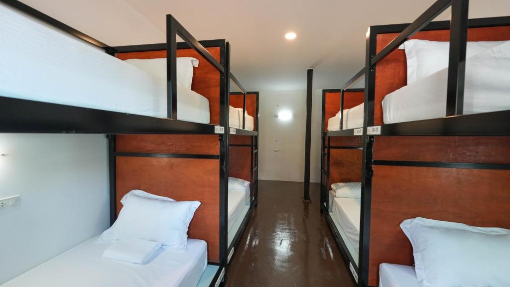 Postel nebo postele na pokoji v ubytování Green Gen Hotel, Mueang Phuket