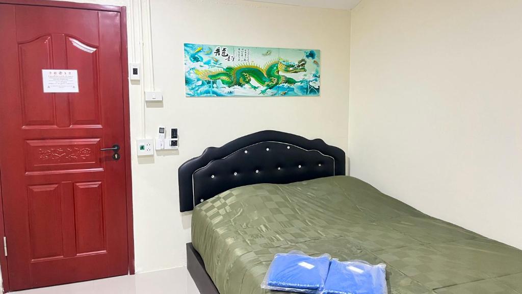 Postel nebo postele na pokoji v ubytování Pa Chalermchai Guesthouse