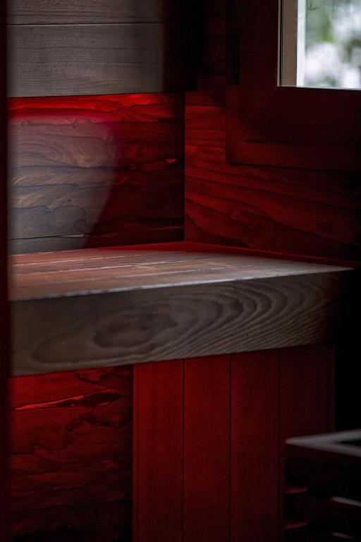 a room with wooden floors and a window at Costa Rica Bibione SPA in Bibione
