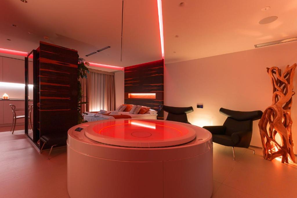 a living room with a couch and a table at Costa Rica Bibione SPA in Bibione