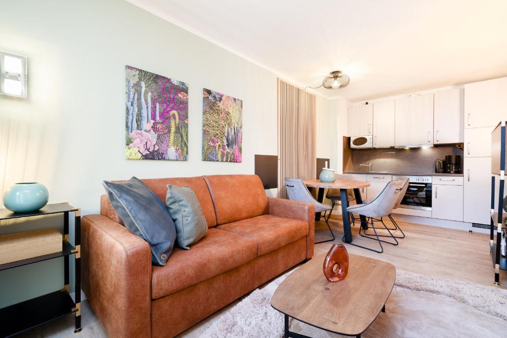 Posezení v ubytování Das Solaris 3 Beach Apartment mit Balkon, Gemeinschaftssauna und Grillplatz