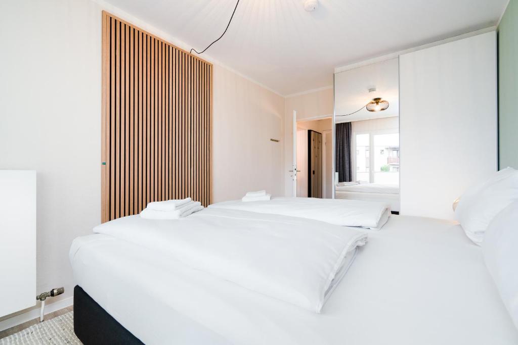Postel nebo postele na pokoji v ubytování Das Solaris 3 Beach Apartment mit Balkon, Gemeinschaftssauna und Grillplatz