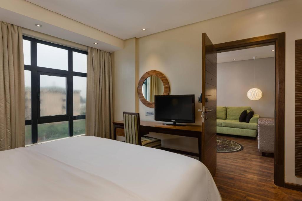 Postel nebo postele na pokoji v ubytování Protea Hotel by Marriott Benin City Select Emotan