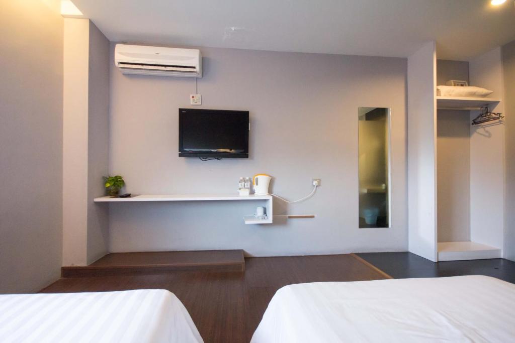 Postel nebo postele na pokoji v ubytování Chariton Hotel Ipoh