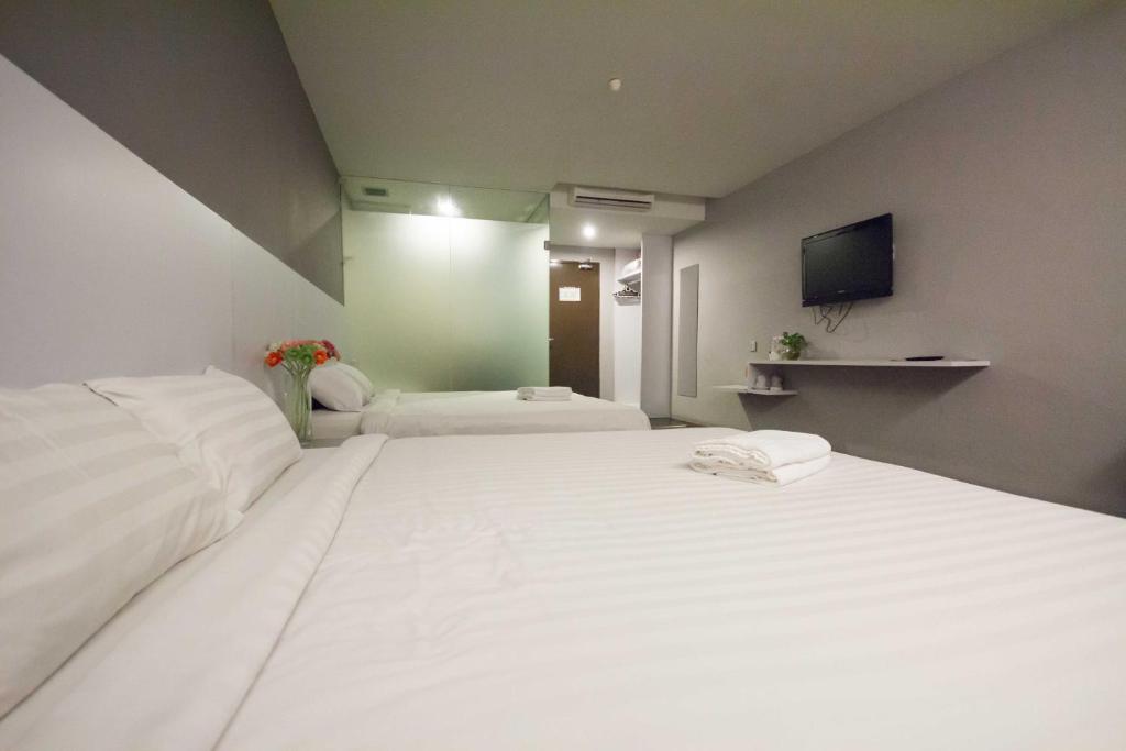 Postel nebo postele na pokoji v ubytování Chariton Hotel Ipoh
