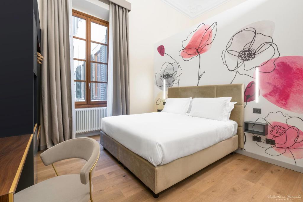 Postel nebo postele na pokoji v ubytování Hotel Adamas