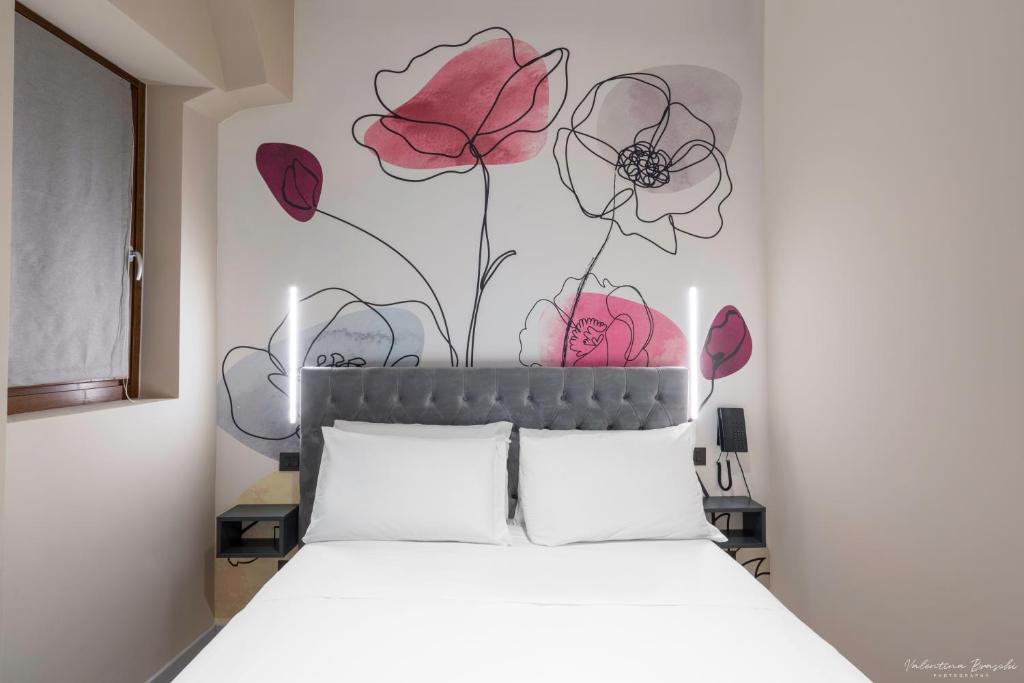 Postel nebo postele na pokoji v ubytování Hotel Adamas