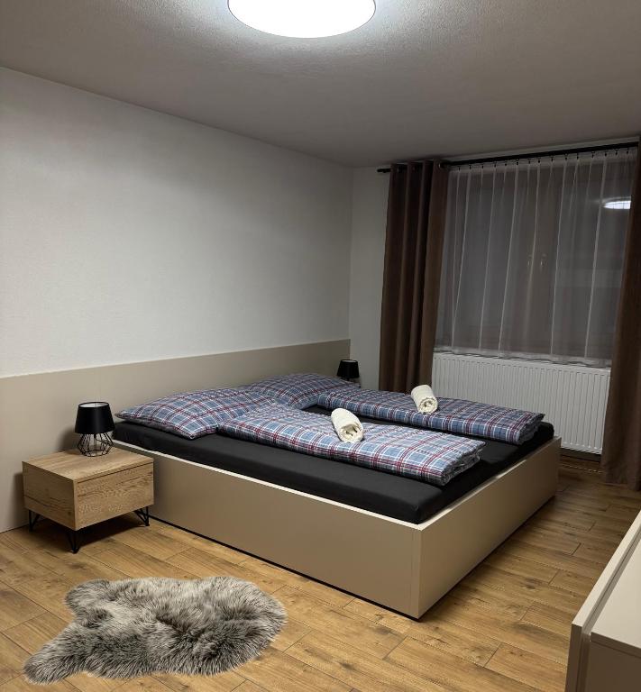 Postel nebo postele na pokoji v ubytování Drevenica Skye Terchová