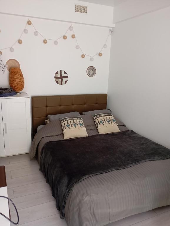 Postel nebo postele na pokoji v ubytování Studio jardin