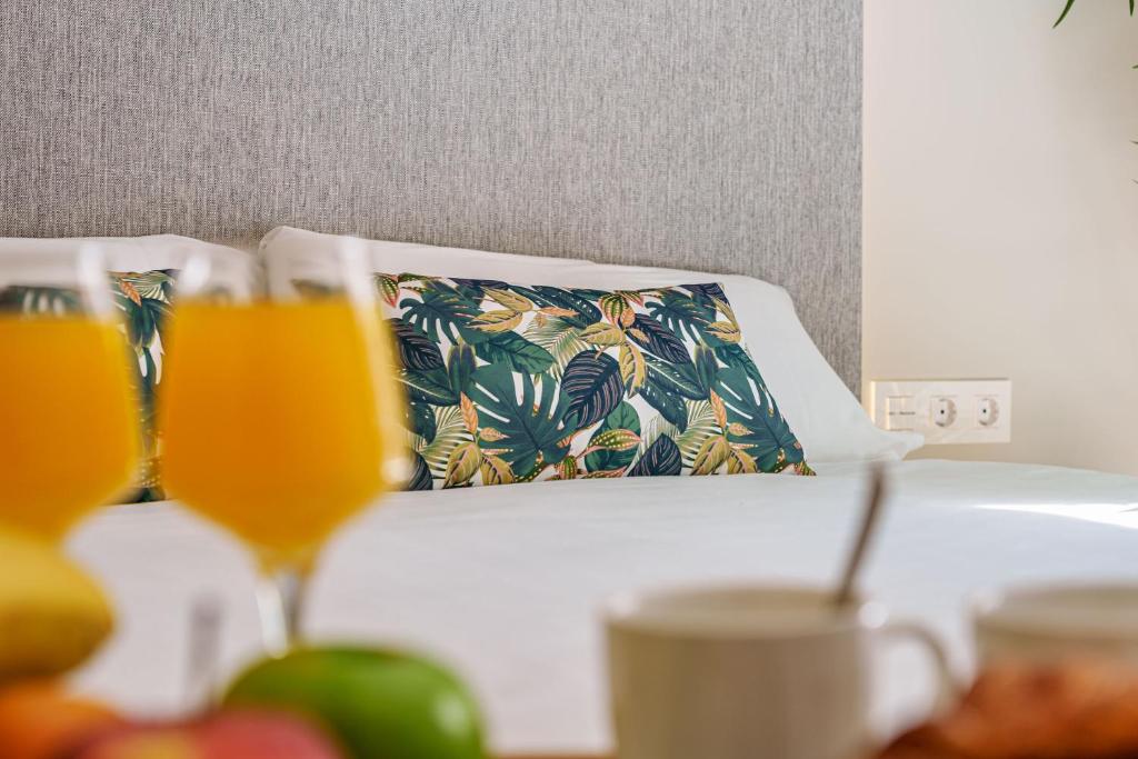 Łóżko lub łóżka w pokoju w obiekcie SUNSET MALAGA - PRIME & DESIGN