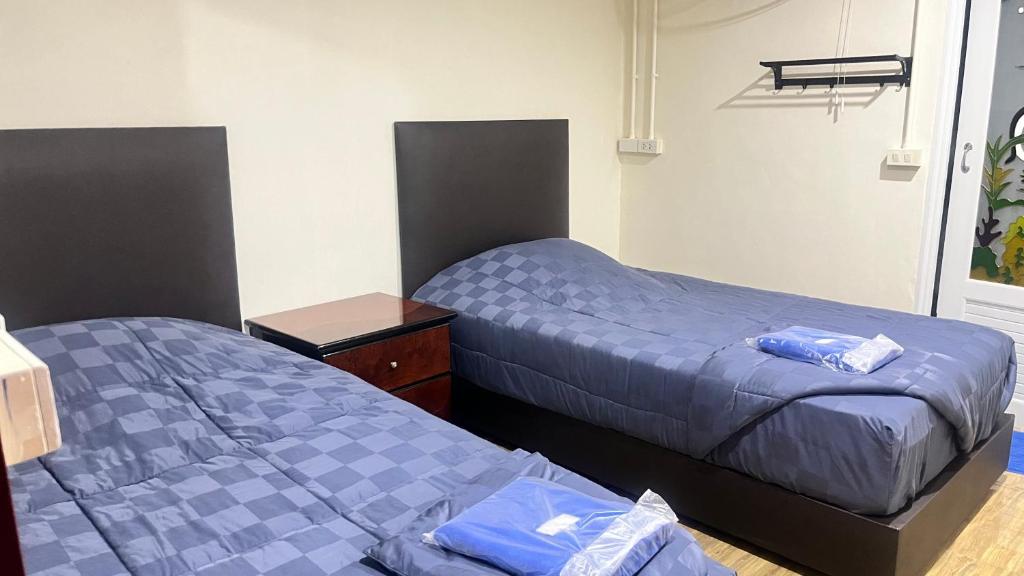 Postel nebo postele na pokoji v ubytování Pa Chalermchai Guesthouse
