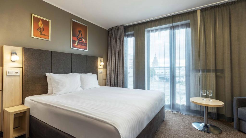 Postel nebo postele na pokoji v ubytování Wellton Riga Hotel & SPA