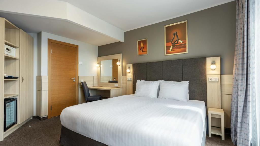 Postel nebo postele na pokoji v ubytování Wellton Riga Hotel & SPA