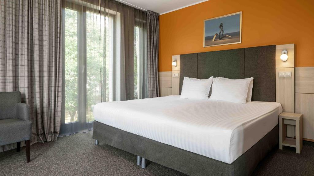 Postel nebo postele na pokoji v ubytování Wellton Riga Hotel & SPA