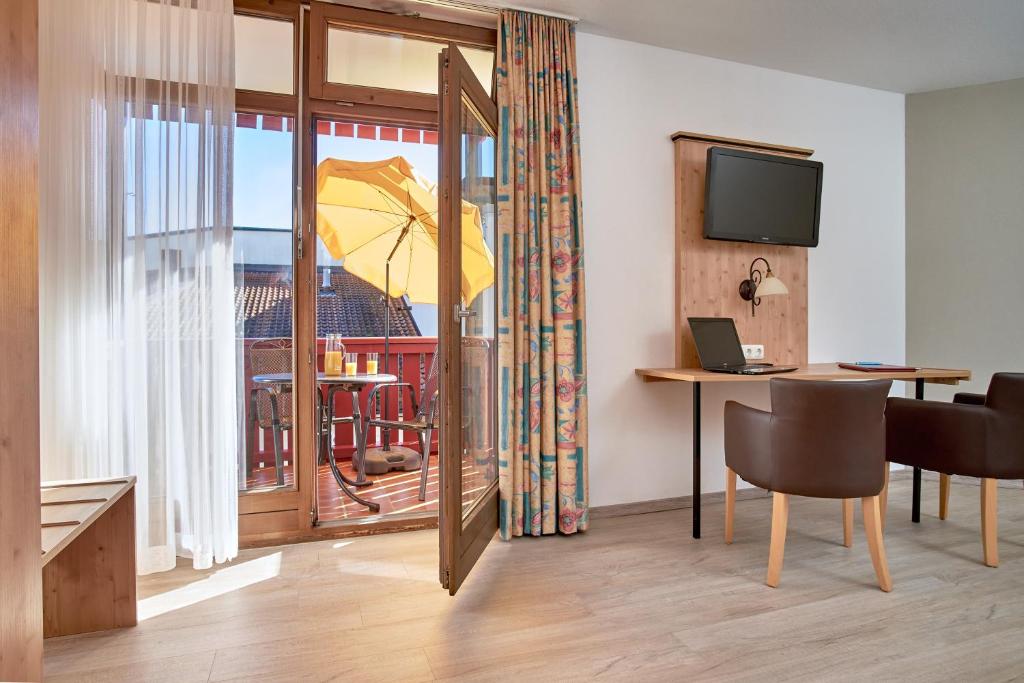 TV a/nebo společenská místnost v ubytování Apparthotel Minerva Diana Octavia