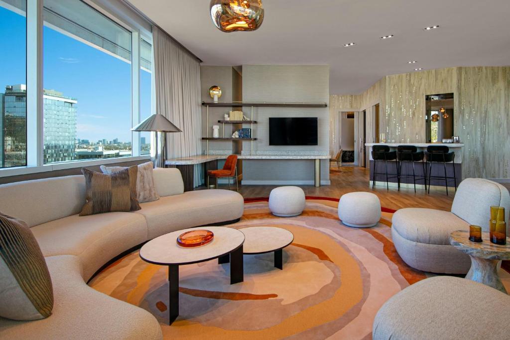 a living room with a couch and a table at W Hollywood in Los Angeles