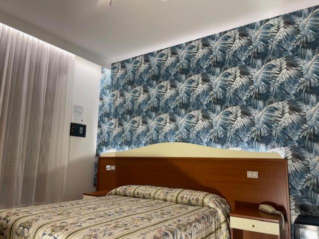 Postel nebo postele na pokoji v ubytování Hotel Coralba