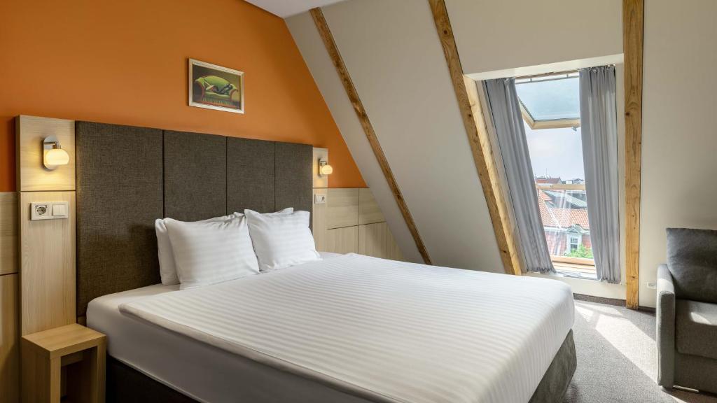 Postel nebo postele na pokoji v ubytování Wellton Riga Hotel & SPA