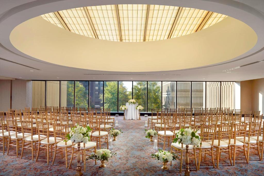 a room with rows of chairs and a wedding at The Westin Peachtree Plaza, Atlanta in Atlanta
