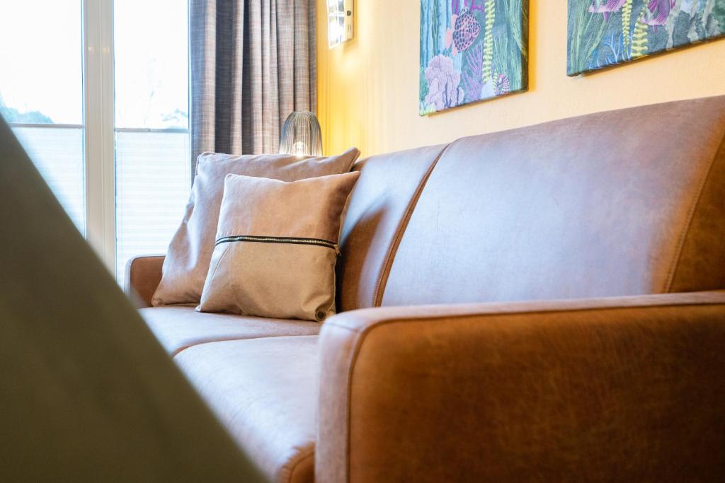 Posezení v ubytování Das Solaris 1 Beach Apartment mit Balkon, hundefreundlich und modern