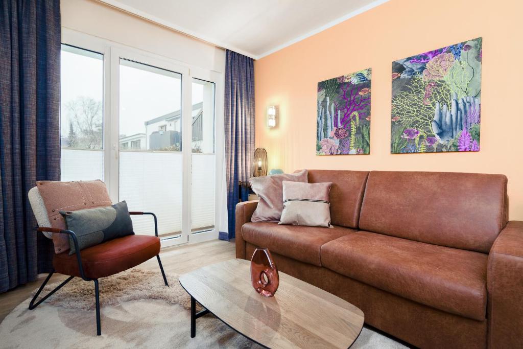 Posezení v ubytování Das Solaris 17 Beach Apartment mit Balkon, hundefreundlich und strandnah