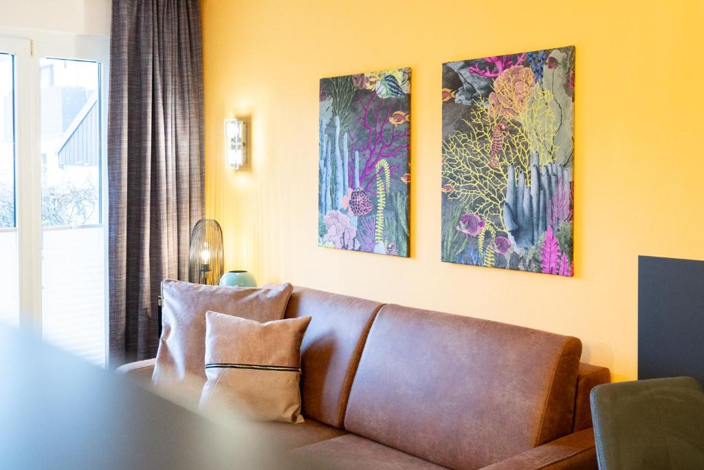 Posezení v ubytování Das Solaris 17 Beach Apartment mit Balkon, hundefreundlich und strandnah