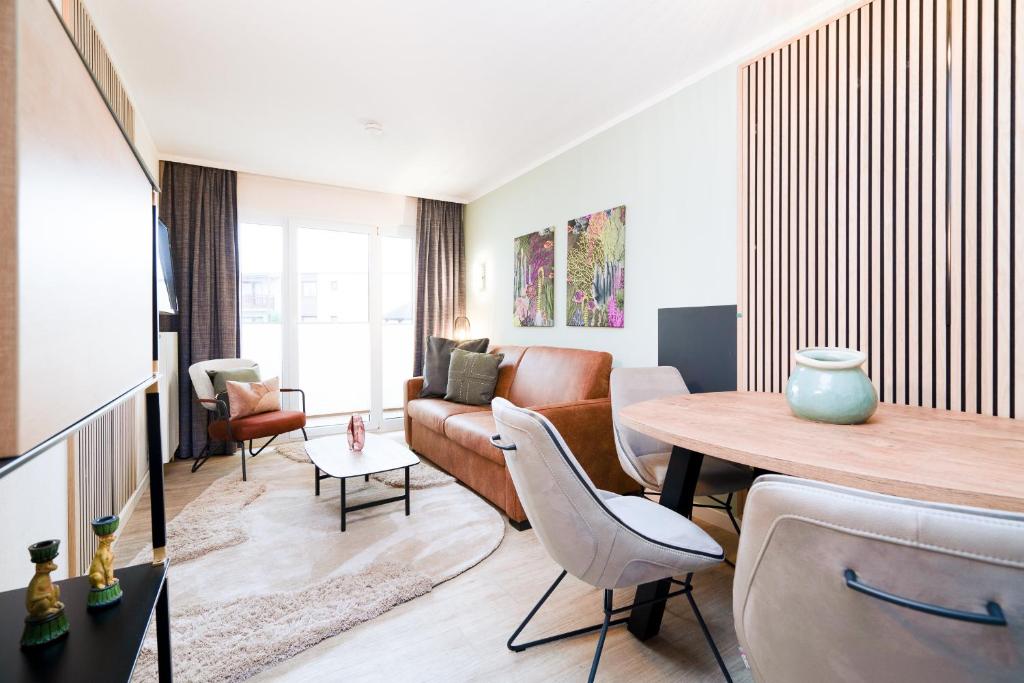 Posezení v ubytování Das Solaris 5 Beach Apartment mit Balkon, Gemeinschaftssauna und Grillplatz