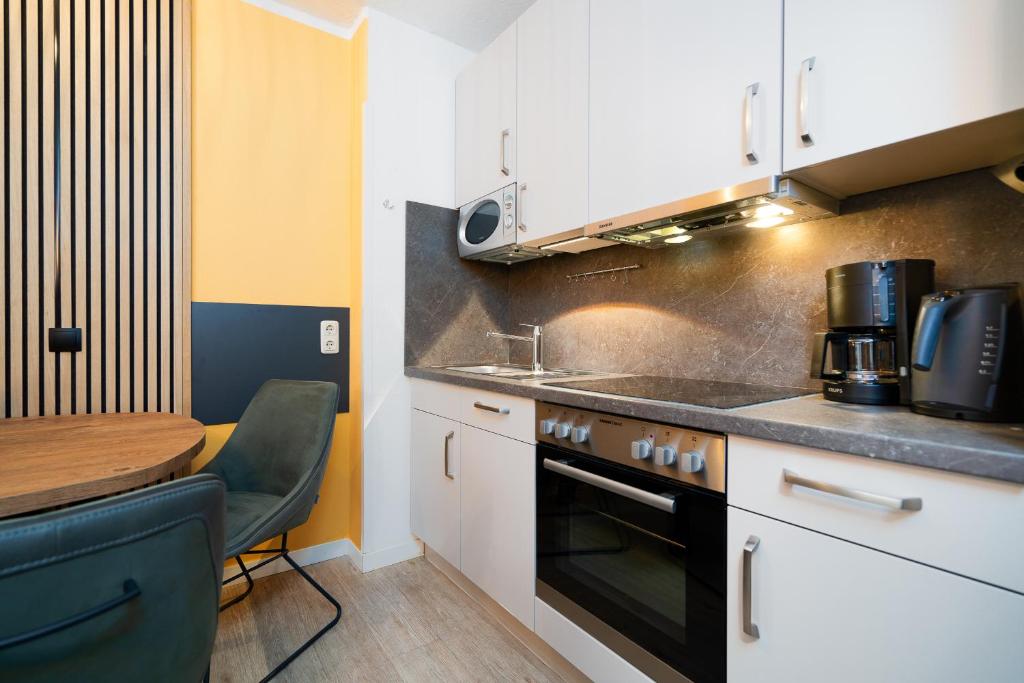 Kuchyň nebo kuchyňský kout v ubytování Das Solaris 16 Beach Apartment strandnah und hundefreundlich