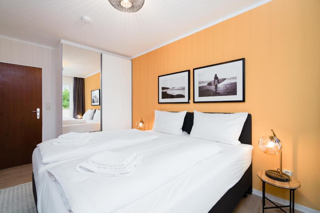 Postel nebo postele na pokoji v ubytování Das Solaris 16 Beach Apartment strandnah und hundefreundlich
