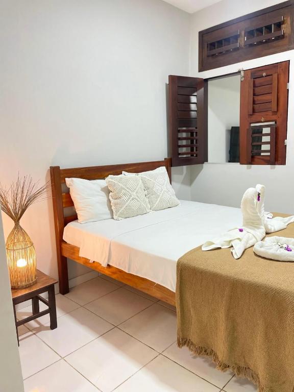 Cama ou camas em um quarto em Pousada Por do Sol