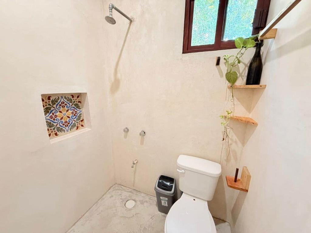 Koupelna v ubytování Kuun Beek, hotel y centro holistico
