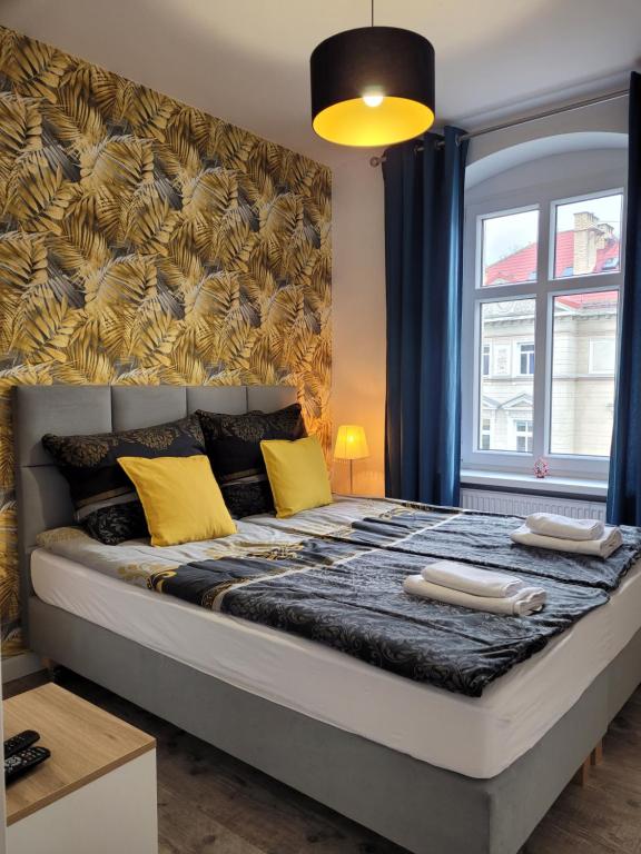 Posteľ alebo postele v izbe v ubytovaní Apartament Przy Placu Piastowskim