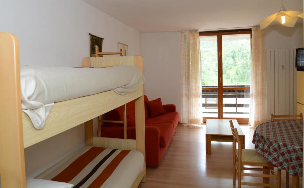 En eller flere senge i et værelse på Gran Baita