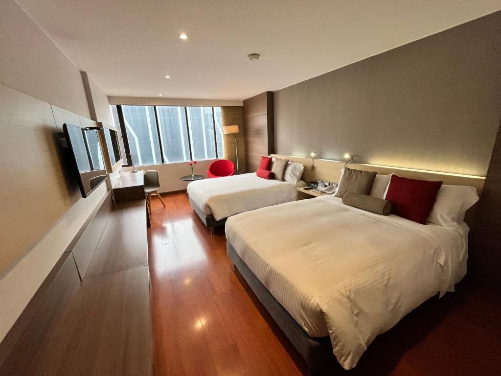 Postel nebo postele na pokoji v ubytování Cosmos 100 Hotel & Centro de Convenciones - Hoteles Cosmos