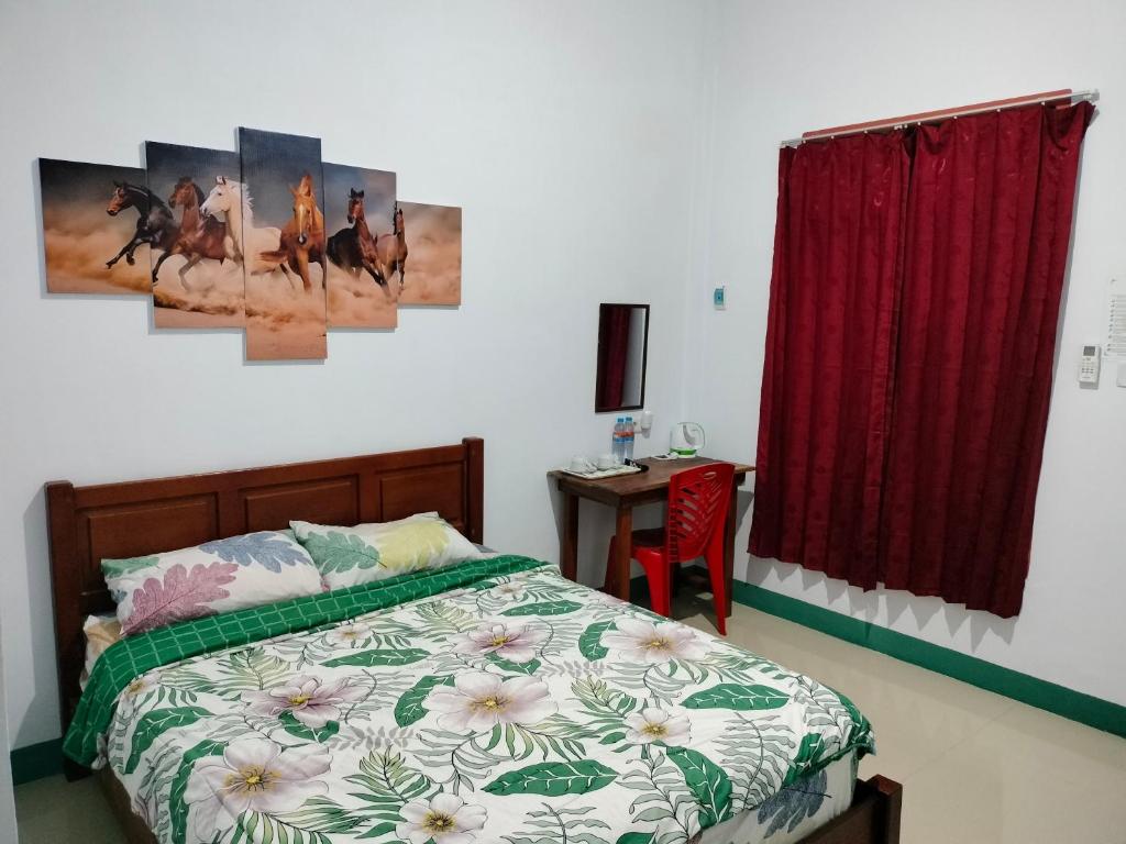Postel nebo postele na pokoji v ubytování Tanah merah guest house