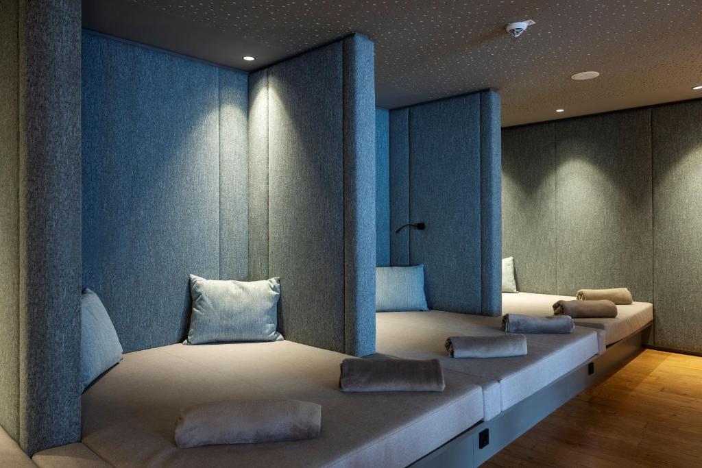 Postel nebo postele na pokoji v ubytování Almwellness Hotel Pierer