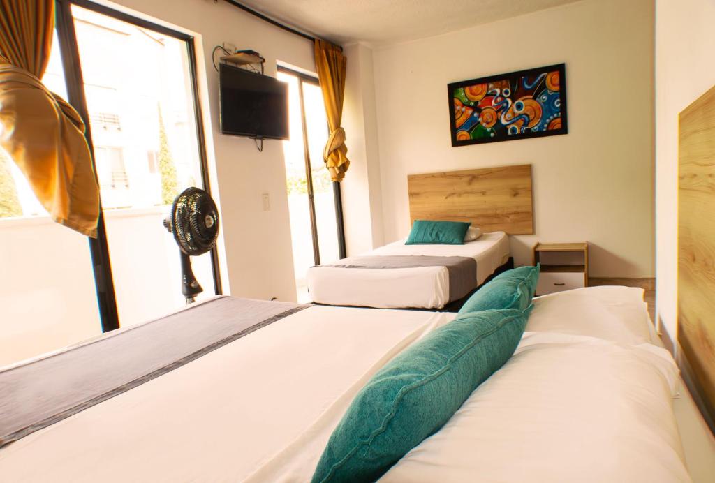 Postel nebo postele na pokoji v ubytování Hotel Balcones del Estadio