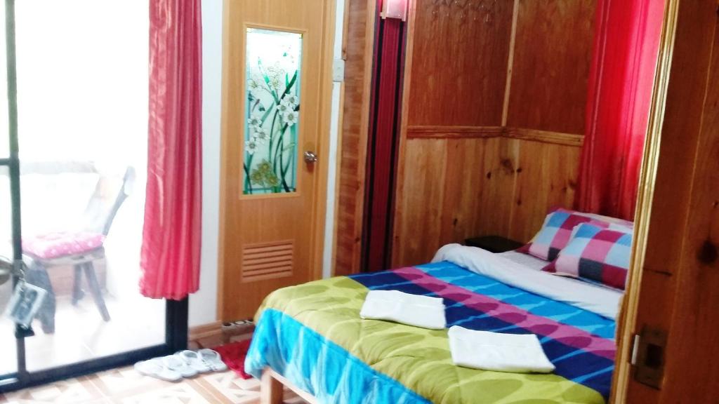 Postel nebo postele na pokoji v ubytování Rice Homestay