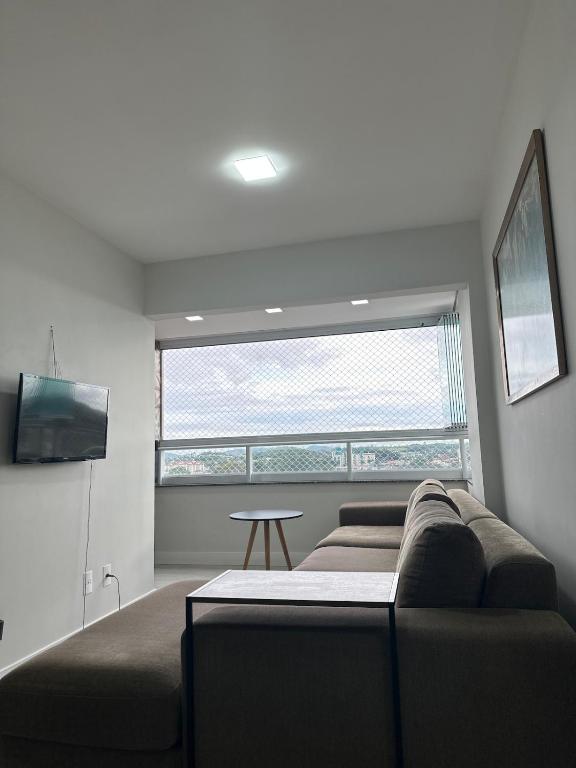 Μια τηλεόραση ή/και κέντρο ψυχαγωγίας στο Apartamento Bairro Floresta